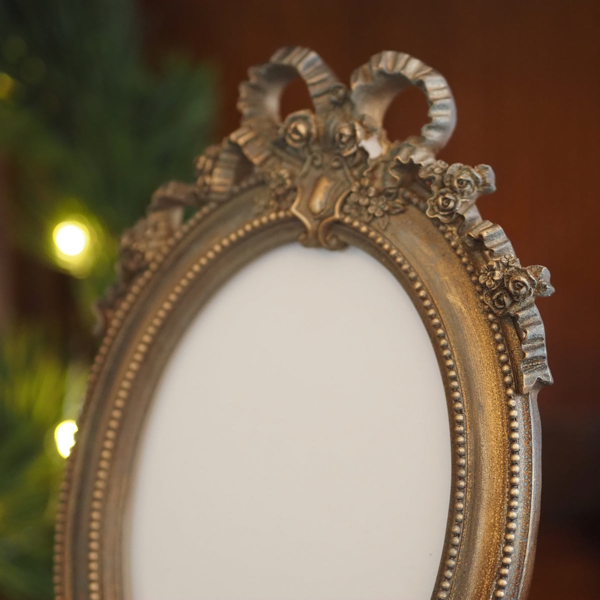 Fotorahmen 13x18 Oval · Louis-seize Schleife Altgold-Optik