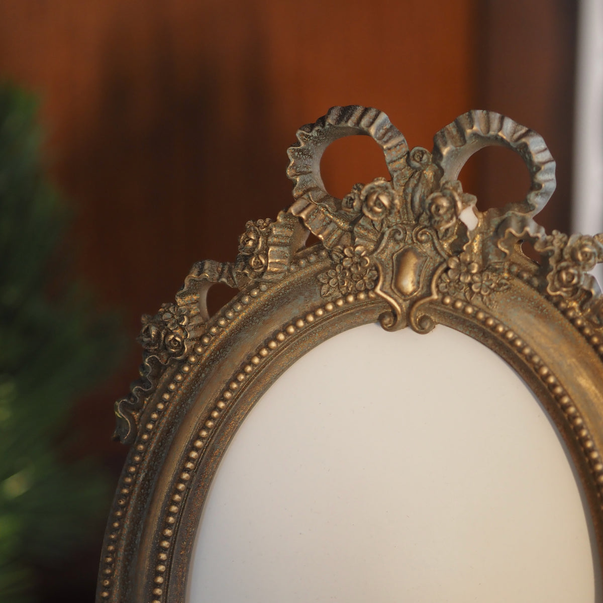 Fotorahmen 13x18 Oval · Louis-seize Schleife Altgold-Optik