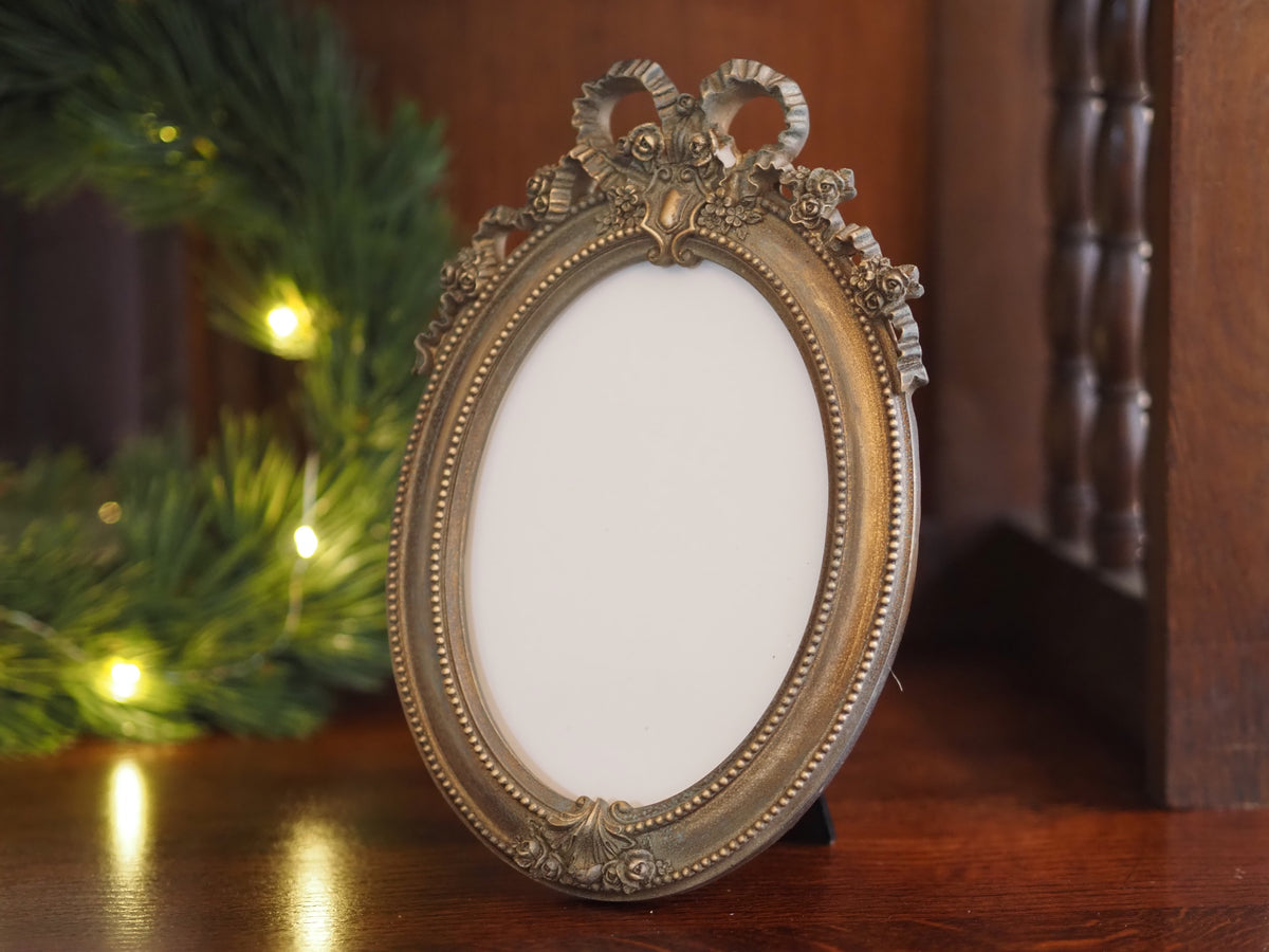Fotorahmen 13x18 Oval · Louis-seize Schleife Altgold-Optik