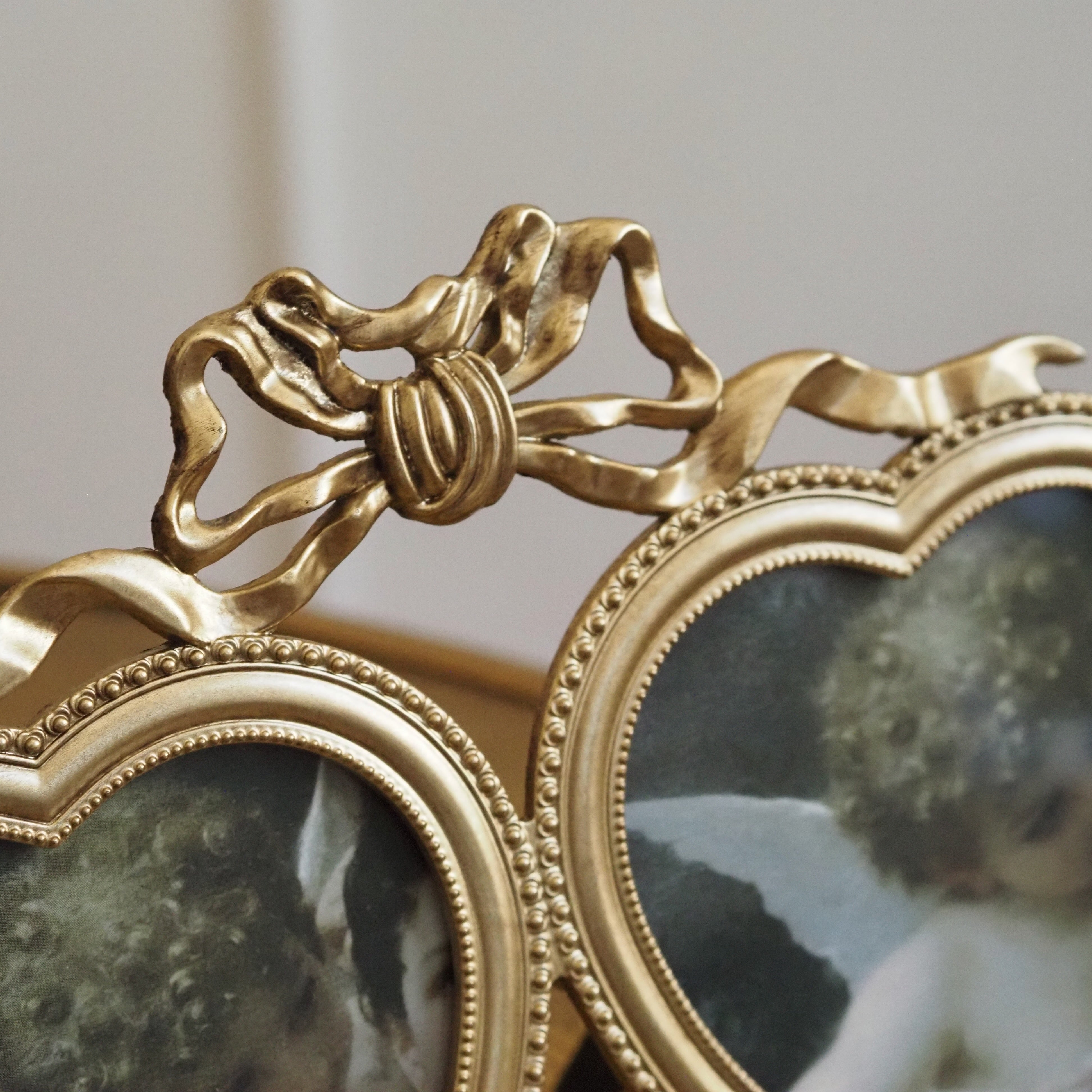 Doppelbilderrahmen Herz · Verschlungene Schleife in Antikgold